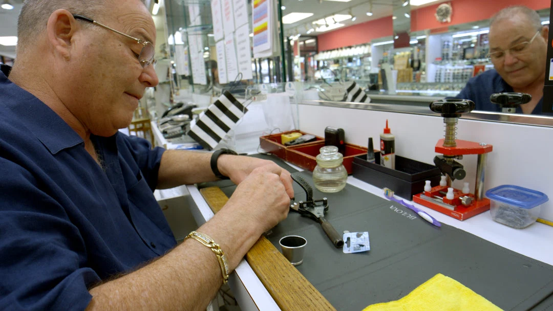 A Salermo jeweler working with tools at the workshop bench